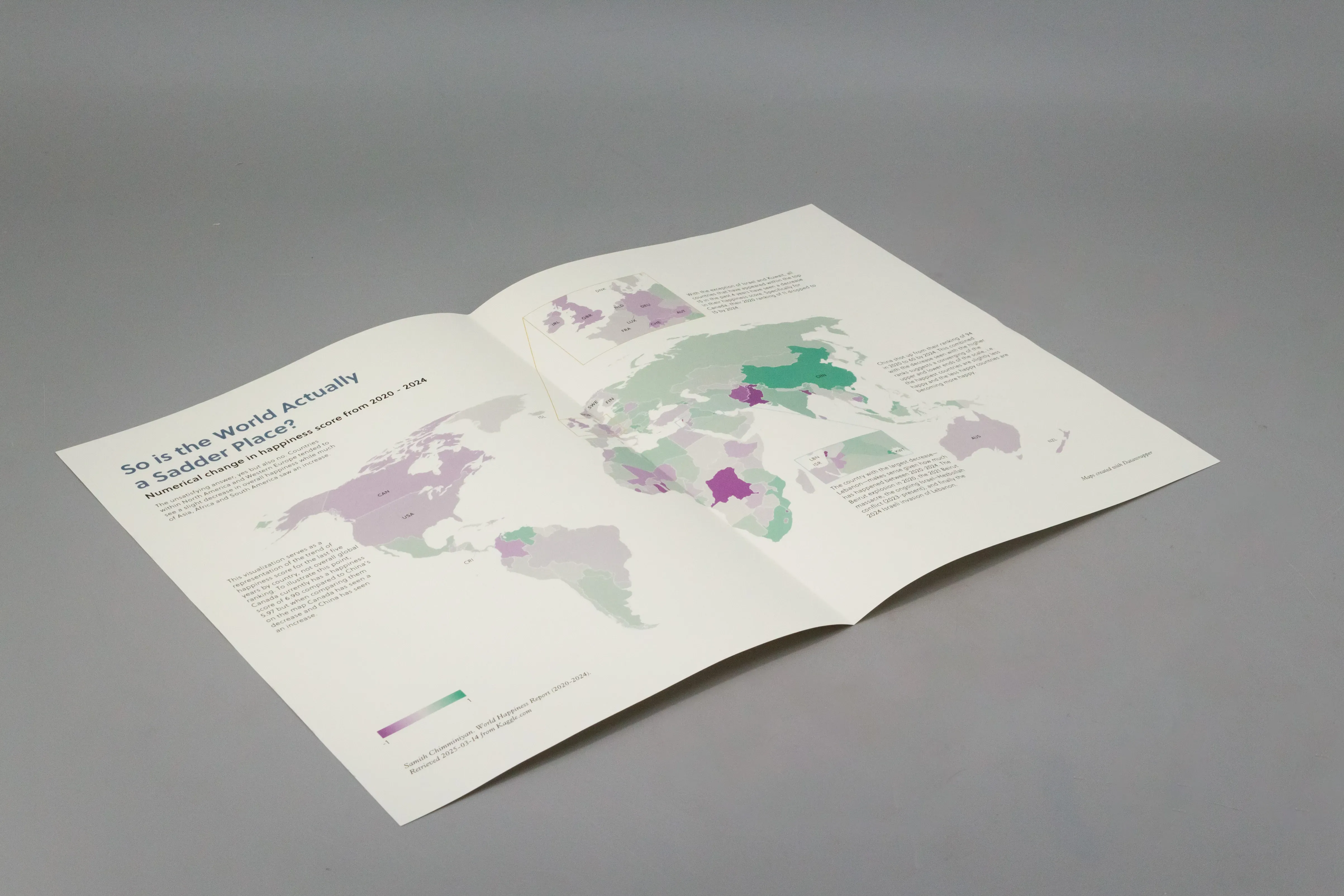 Inner spread showing data visualizations about world happiness trends